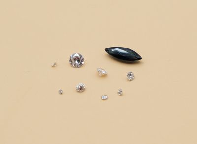 three different types of diamonds on a yellow surface