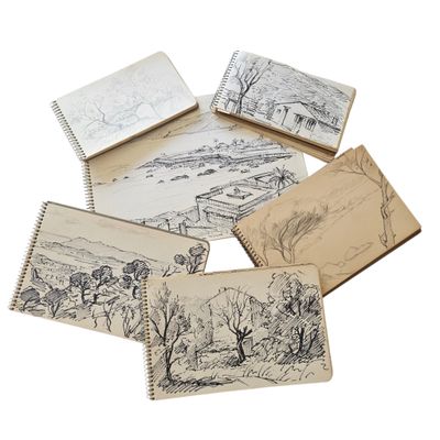 six cahiers contenant des dessins d'arbres avec une rivière en arrière-plan