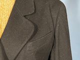 a close up of a brown jacket with a yellow tie