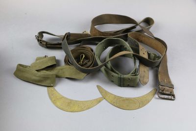 a pair of glasses and a pair of belt on a table