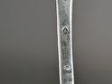 a close up of a fork with a piece of meat on it