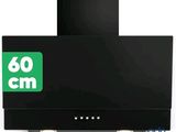 a close up of a black stove top oven with a green sign on it