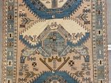 an image of a rug on the floor with a cat laying on it