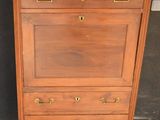 a wooden cabinet with a marble top on a sidewalk