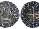 une pièce d'argent avec une croix au recto et une croix au verso