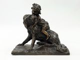 bronze statue of a boy on a dog on a white background