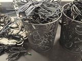 two buckets filled with wires and wires on a table