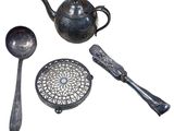 a teapot, spoons, and a teapot on a white background