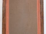 an old picture frame with a brown background and a red border