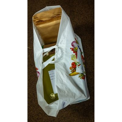 a bag with a bottle of wine and a bottle of wine in it