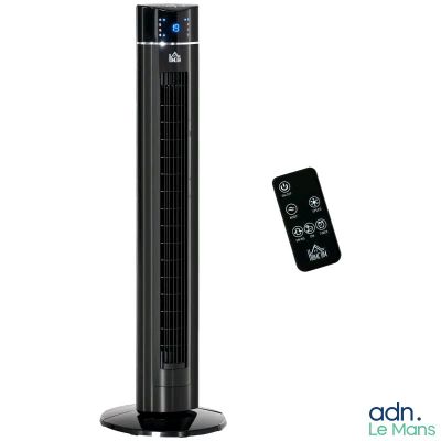 Le ventilateur colonne noir se trouve à côté d'une télécommande