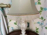 a lamp that is sitting on a table in a room