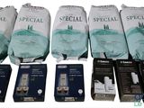 several packages of medical supplies are lined up on a white surface