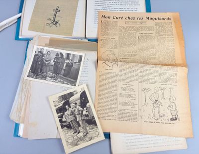 a lot of old papers and pictures on the table