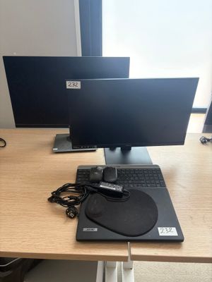a laptop and a monitor on a desk with a mouse and keyboard