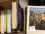 many books that are sitting in a box on the floor