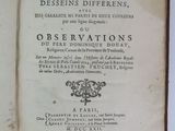 an open book on a white table with a black and white title