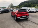a red car that is parked in a parking lot