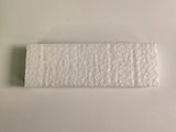 two pieces of white paper sitting on top of a white surface