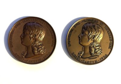 two gold coins with a woman ' s face on them