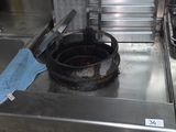 stainless steel counter top with a frying pan on top of it