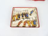 a box of toy soldiers that are sitting on a table