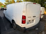 a white van that is parked in a parking lot