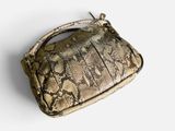 snake skin handbag on a white background