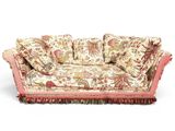 an image of a floral couch with pillows on it
