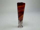 an image of a silver vase with a brown and red swirl design