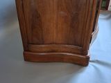 a wooden cabinet that is sitting on a table