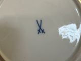 a white plate with a blue design on it