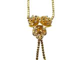 an image of a gold necklace with a flower design on it