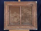 an old wooden easel with a painting on top of it