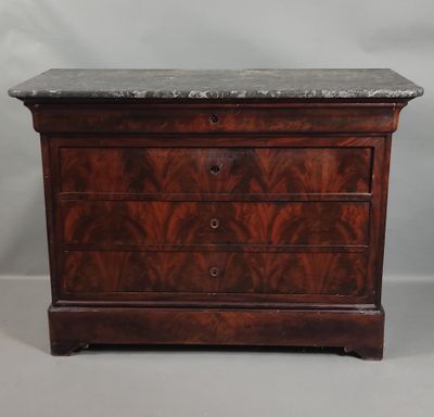 an antique chest of drawers with marble top