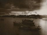 a black and white photo of a boat in the water