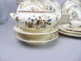 a lot of plates and bowls that are on a table