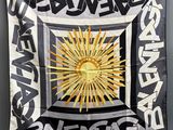 an image of a black and white banner with a sun on it