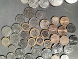 a lot of coins that are on the table