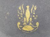 a yellow drawing of a cat on the street