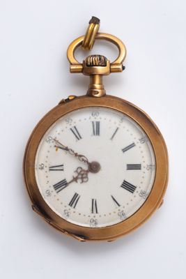 a gold pocket watch with roman numerals on it