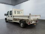 a white truck with a cage on the back of it