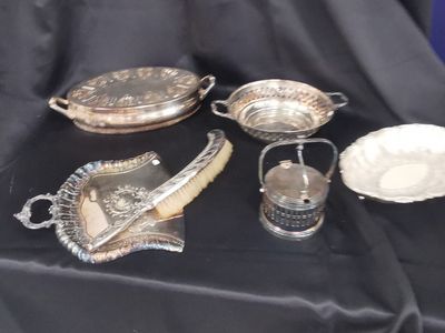 a table with a lot of silver items on it