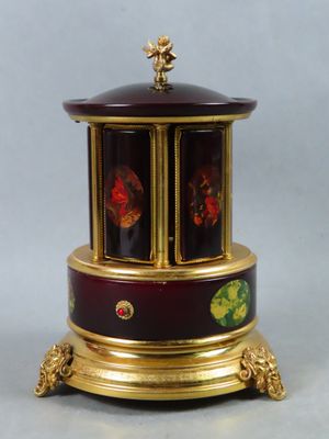 a small clock that is on top of a table
