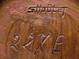 a close up of a metal object with writing on it