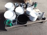 a lot of dishes and cups on a pallet