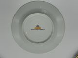 a white plate with a yellow and black design on it