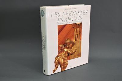 une image représentant un livre surmonté d'une statue en or