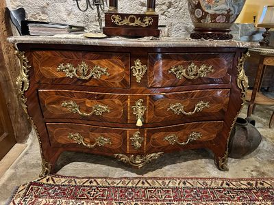 a large chest of drawers in a room with a rug on the floor