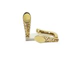 deux paires de boutons de manchette en or sur fond blanc